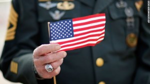 131119154314-veteran-generic-holding-flag-story-top